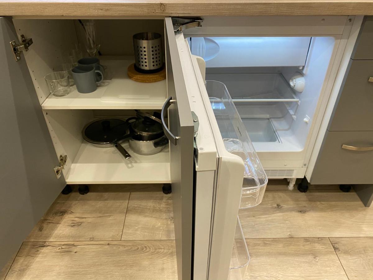 Aparthotel Рига Екстериор снимка A refrigerator with a built-in ice maker