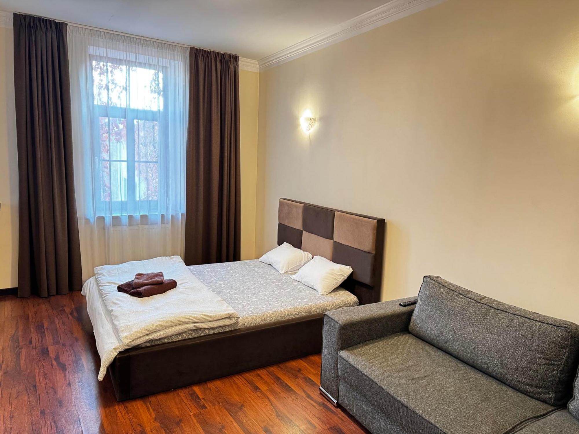 Aparthotel Рига Екстериор снимка A bedroom in a hotel