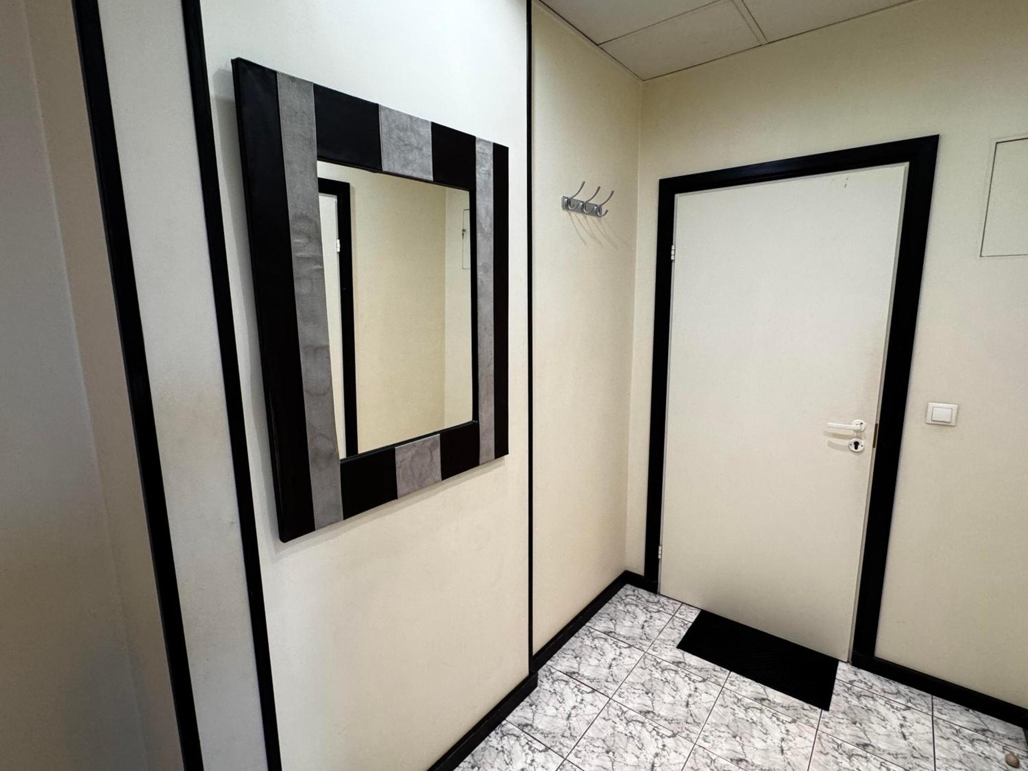 Aparthotel Рига Екстериор снимка A mirror in a bathroom