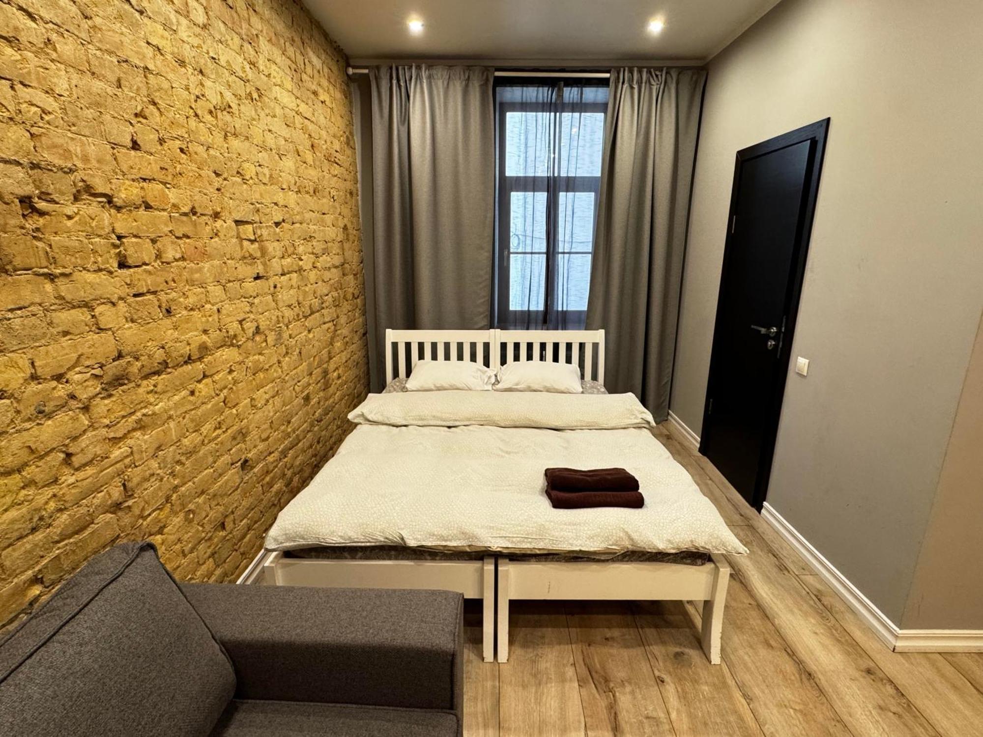 Aparthotel Рига Екстериор снимка A typical micro apartment in Warsaw, Poland